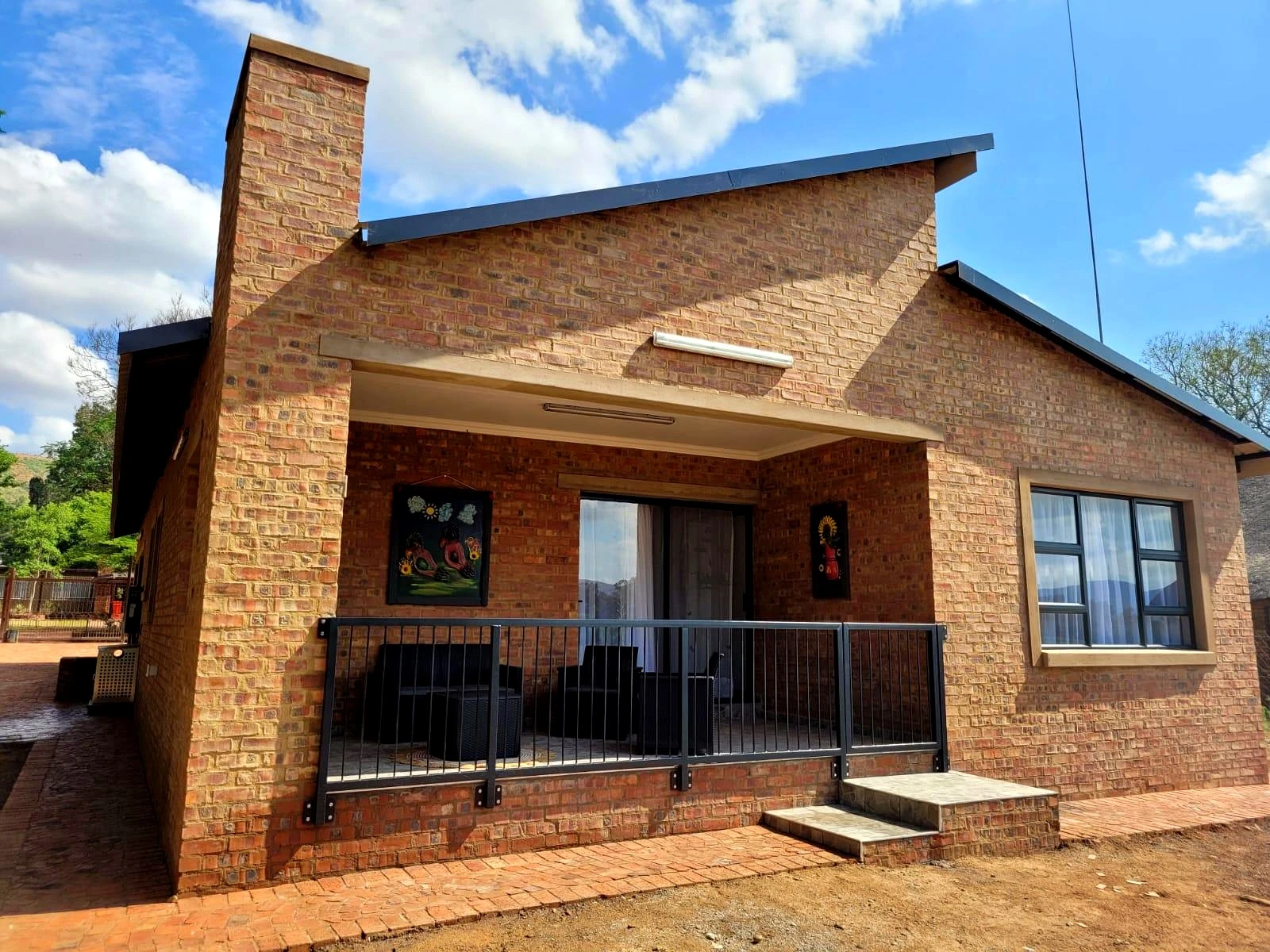Brick house front entrance exterior with completed residential finishes