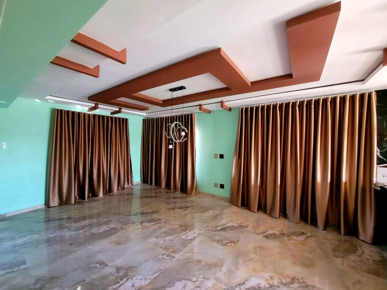 Decorative ceiling design in a formal lounge room interior