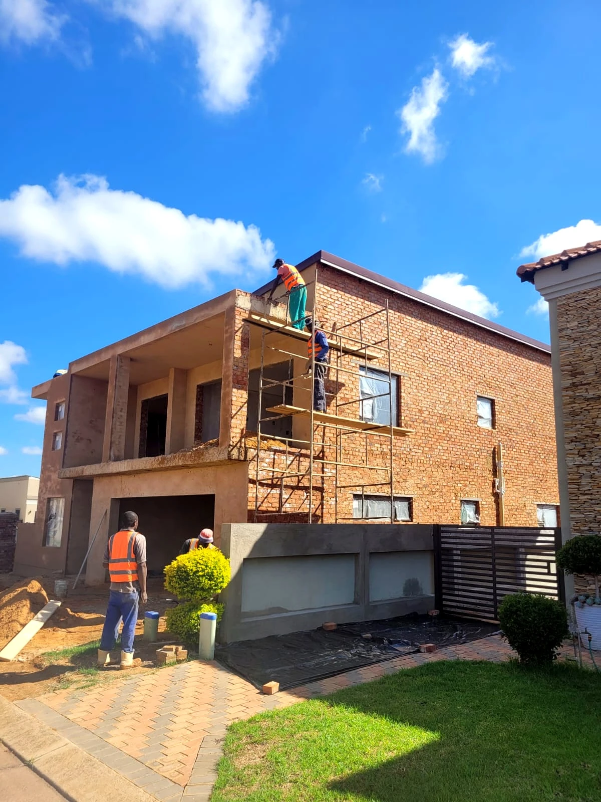 Double storey brick house exterior construction project