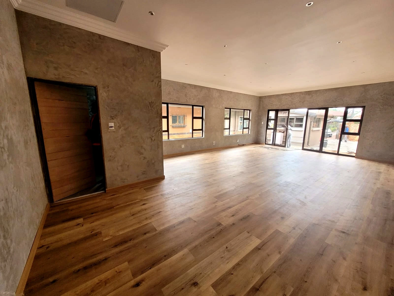 Open plan living room with wood flooring installation