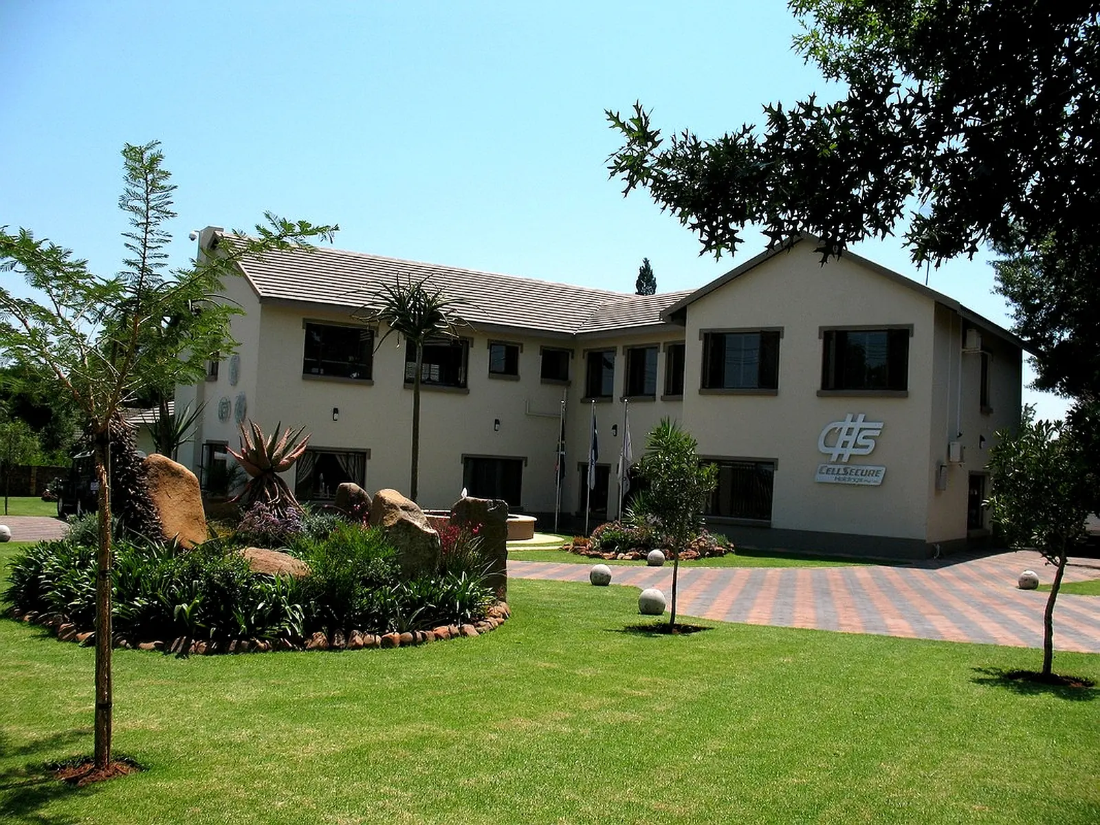 New residential build by CT4 home builders in Gauteng with landscaped garden and modern exterior.